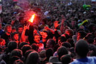 Enthusiastic partygoers at Rock am Ring soak up the exhilarating atmosphere on day three of the festival in 2011.