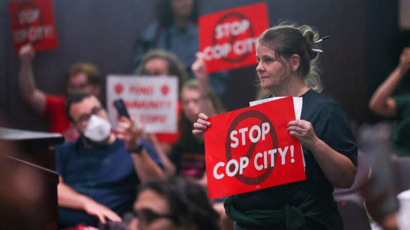 Protestors reacts before the council members voted 11 to 4 to approve legislation to fund the training center, on Tuesday, June 6, 2023, in Atlanta.