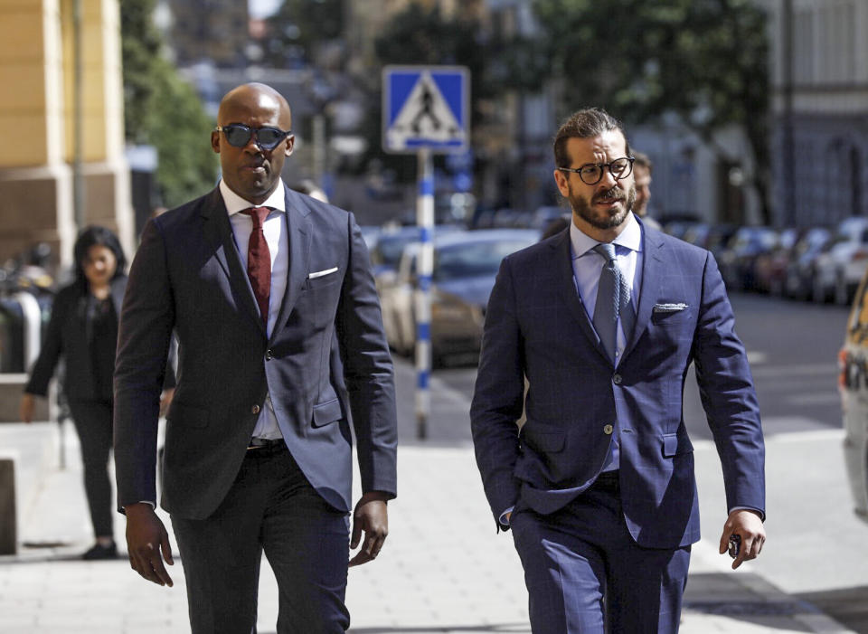 US Attorney Damien Granderson, left, and US rapper A$AP Rocky's defence lawyer Slobodan Jovicic, arrive at the district court in Stockholm, during the second day of his trial, Thursday, Aug. 1, 2019. A$AP Rocky, real name Rakim Mayers testified Thursday at his assault trial in Sweden that he did everything possible to avoid conflict with two men he said persistently followed his entourage in Stockholm, saying that one of the men picked a fight with one of his bodyguards. (Fredrik Persson/TT News Agency via AP)