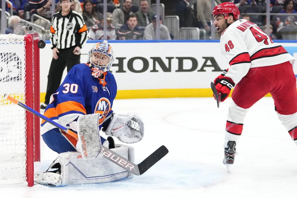 New York Islanders goaltender Ilya Sorokin (30) stops a shot by Carolina Hurricanes' Jordan Martinook (48) during the first period of Game 6 of an NHL hockey Stanley Cup first-round playoff series Friday, April 28, 2023, in Elmont, N.Y. (AP Photo/Frank Franklin II)