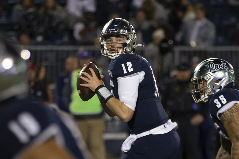 Nevada quarterback Carson Strong (12) looks to throw against UNLV in the first half of an NCAA college football game in Reno, Nev., Friday, Oct. 29, 2021. (AP Photo/Tom R. Smedes)