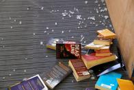 Books seen littered on the ground inside a library inside the Hong Kong Polytechnic University in Hong Kong