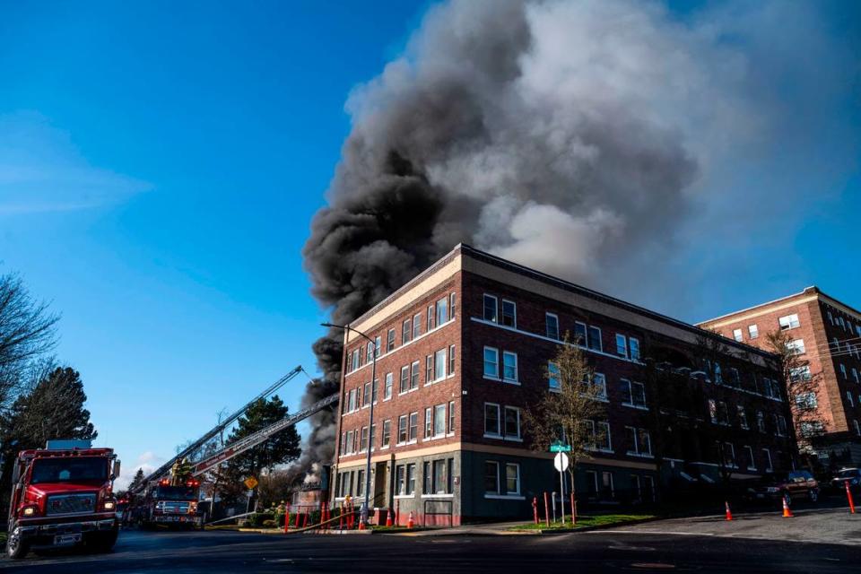 Tacoma firefighters battle a large commercial building fire at the 700 block of Fawcett Avenue in Tacoma, Wash. on March 21, 2023. Tacoma Fire Department spokesperson Joe Meinecke said no injuries have been reported, but crews aren’t sure whether anyone was inside when the fire started. He said the building is supposed to be vacant.