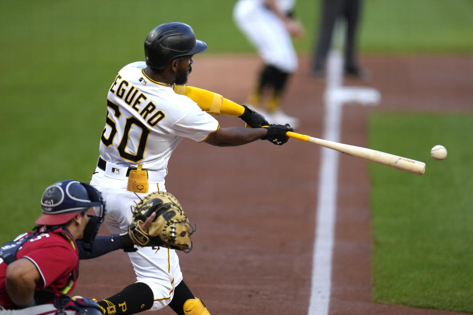 Pittsburgh Pirates' Liover Peguero hits an RBI single off Washington Nationals starting pitcher Jackson Rutledge during the first inning of a baseball game in Pittsburgh, Wednesday, Sept. 13, 2023. (AP Photo/Gene J. Puskar)