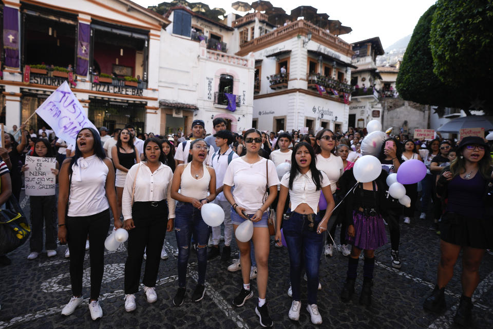 Women chant the word "justice" during a demonstration protesting the kidnapping and killing of an 8-year-old girl, in the main square of Taxco, Mexico, Thursday, March 28, 2024. Hours earlier a mob beat a woman to death because she was suspected of kidnapping and killing the young girl. (AP Photo/Fernando Llano)