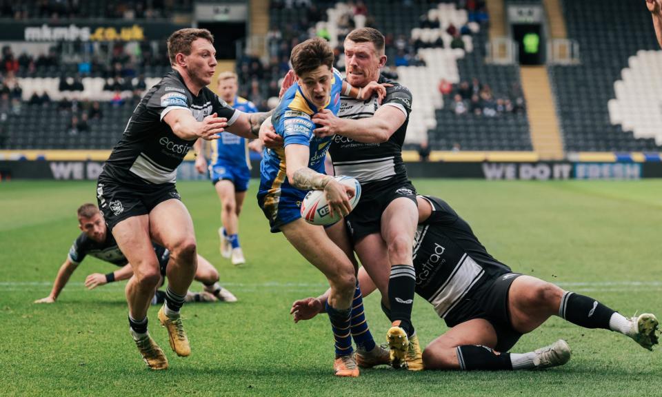 <span>Riley Lumb, on his debut and one of Leeds’ most promising younger players, scores at Hull FC.</span><span>Photograph: Alex Whitehead/SWpix.com</span>