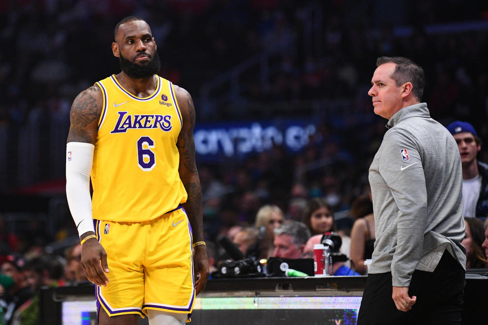 Pictured left, Lakers superstar LeBron James standing alongside former head coach Frank Vogel.