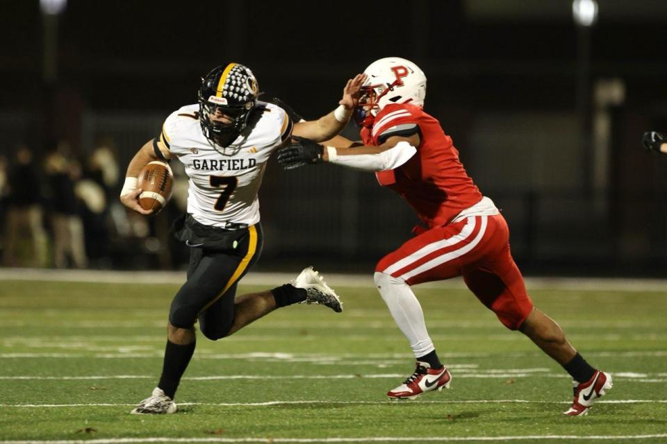 Garfield senior Eric Geddes runs the ball against Perry in Friday's regional semifinal.