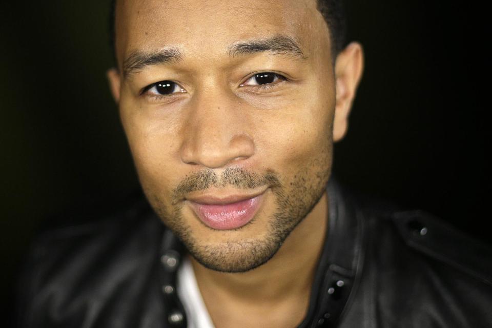 In this Thursday, Aug. 29, 2013 photo, singer John Legend poses for photos after an interview, in Los Angeles. Legend’s fourth album, “Love In The Future,” went on sale on Sept. 3, 2013.. (AP Photo/Jae C. Hong)