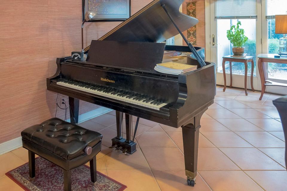 John plays piano and finding a home with space for his grand piano was a top priority.