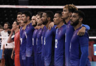 Team France stands for the playing of the national anthems at the start of a men's volleyball semifinal match against Argentina, at the 2020 Summer Olympics, Thursday, Aug. 5, 2021, in Tokyo, Japan. (AP Photo/Manu Fernandez)
