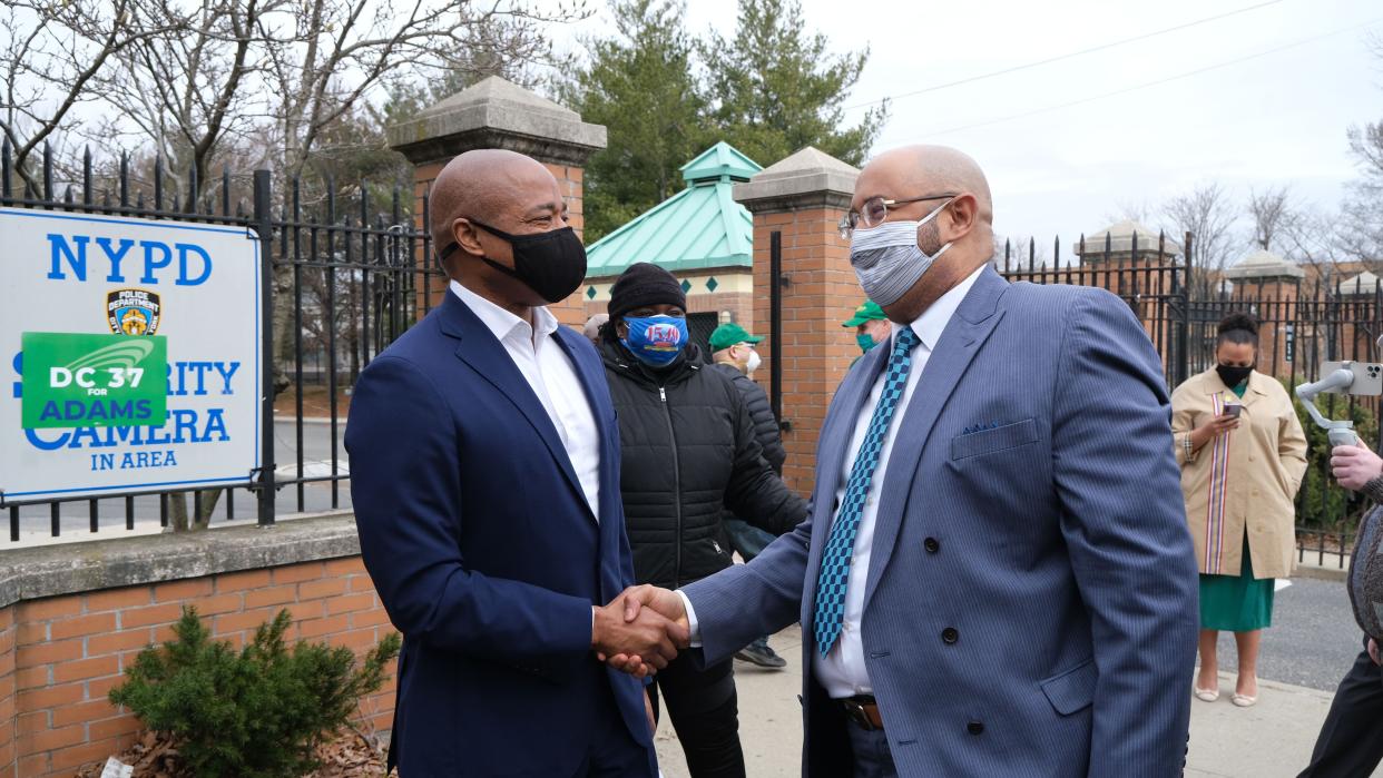 Brooklyn Borough President and New York City mayoral candidate Eric Adams (left) shakes hands with Henry Garrido Executive Director of DC 37 (right) 