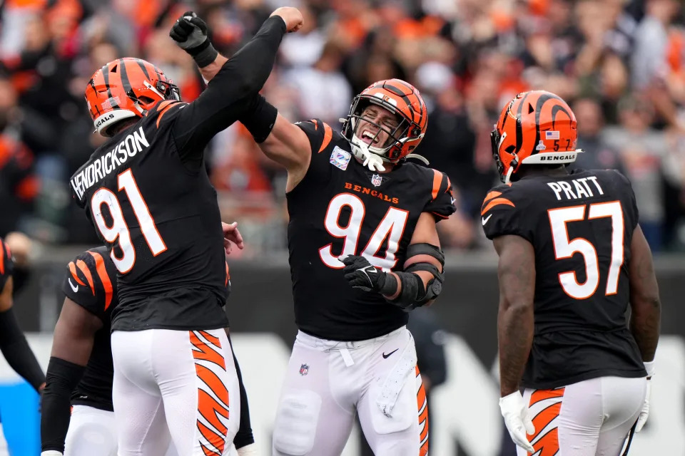 Cincinnati Bengals defensive end Trey Hendrickson (91) and Cincinnati Bengals defensive end Sam Hubbard (94) celebrate a sack in the fourth quarter during an NFL football game between the Seattle Seahawks and the Cincinnati Bengals Sunday, Oct. 15, 2023, at Paycor Stadium in Cincinnati. The Cincinnati Bengals won, 17-13.