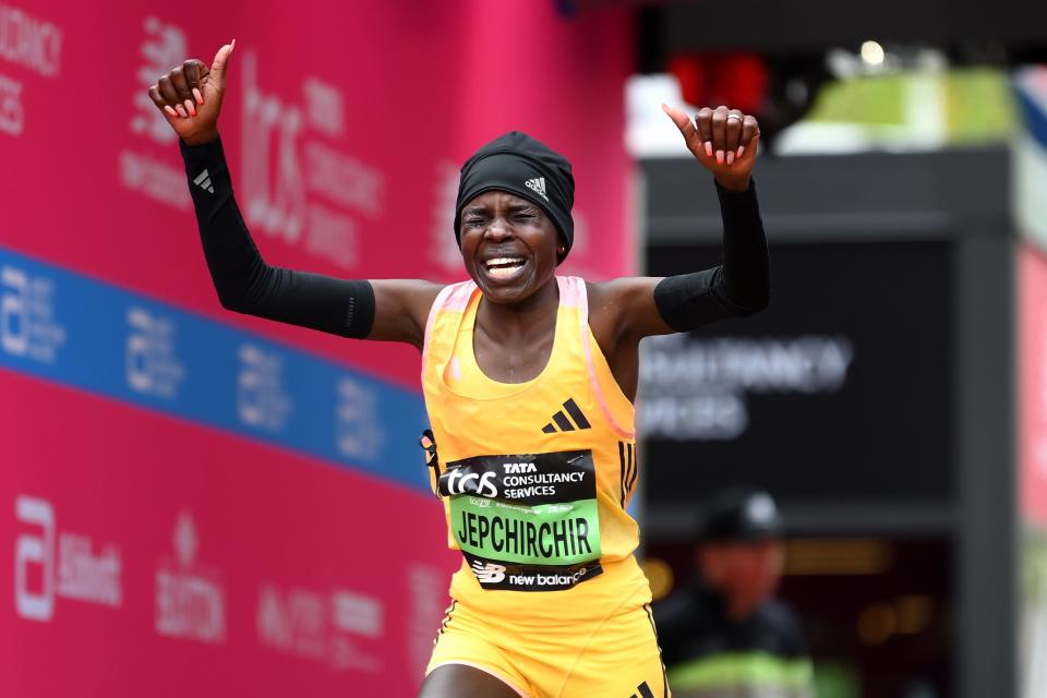 Peres Jepchirchir of Kenya celebrates after winning the women's elite race and setting a new world record during the 2024 TCS London Marathon.