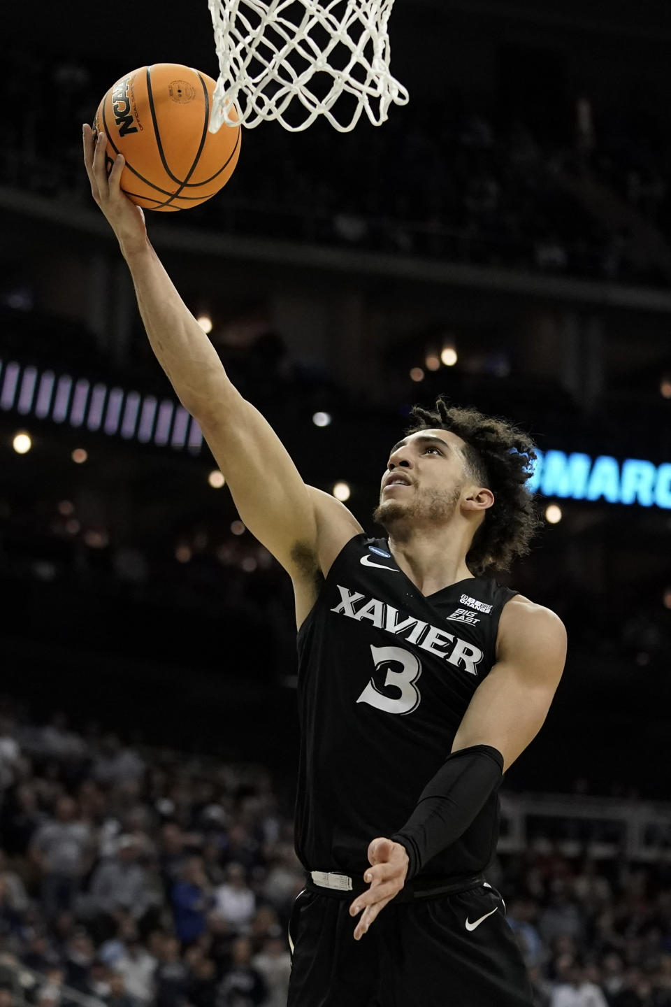 Xavier guard Colby Jones scores against Texas in the first half of a Sweet 16 college basketball game in the Midwest Regional of the NCAA Tournament Friday, March 24, 2023, in Kansas City, Mo. (AP Photo/Charlie Riedel)