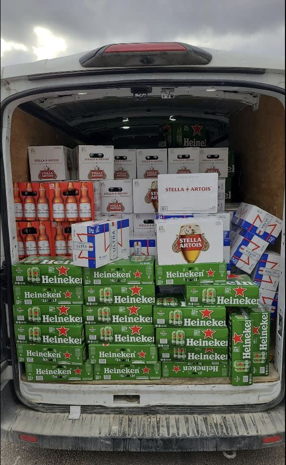 Officers found 326 cases of beer in a van pulled over Wednesday on Highway 401 near Belleville, Ont. (Supplied by OPP - image credit)