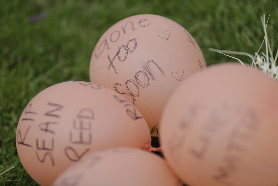 A display is seen, Friday, May 8, 2020, in Indianapolis. near the intersection of 62nd and Michigan Road in Indianapolis, Ind., where Dreasjon Reed was fatality shot by the Indianapolis Metropolitan Police Department. Indianapolis Police Chief Randal Taylor solemnly promised thoroughness and transparency as his department investigates the latest fatal shootings of black men in the city by officers. (AP Photo/Darron Cummings)