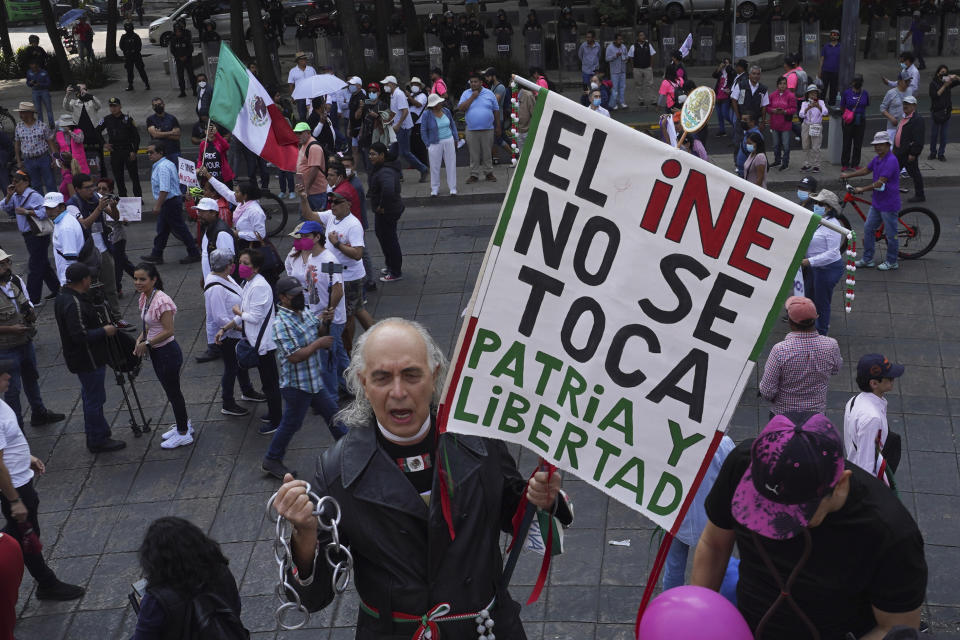 Citizen organizations march in support of Mexico's National Elections Institute as President Andrés Manuel López Obrador pushes to reform it, in Mexico City, Sunday, Nov. 13, 2022. (AP Photo/Marco Ugarte)