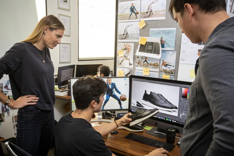 Hope Schneider and Justin Schneider pictured with Evan Tanaka, senior content producer at Wolf and Shepherd