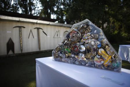 Art made from trash picked from Mount Everest are pictured at a visual art symposium in Kathmandu November 20, 2012. REUTERS/Stringer/Files