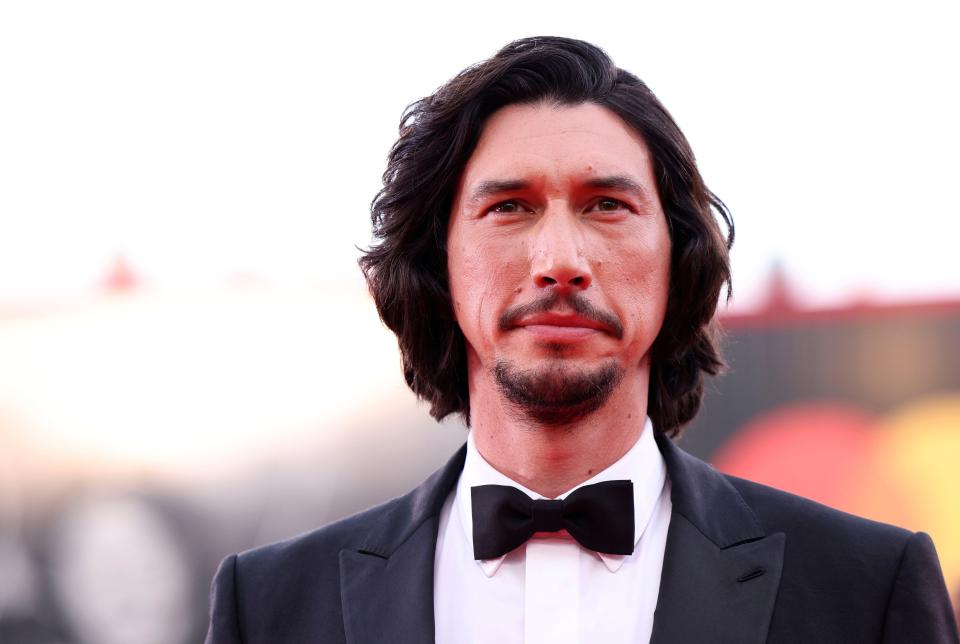 Adam Driver poses for photographers at the "Ferrari" premiere during the 80th annual Venice International Film Festival on Aug. 31, 2023.