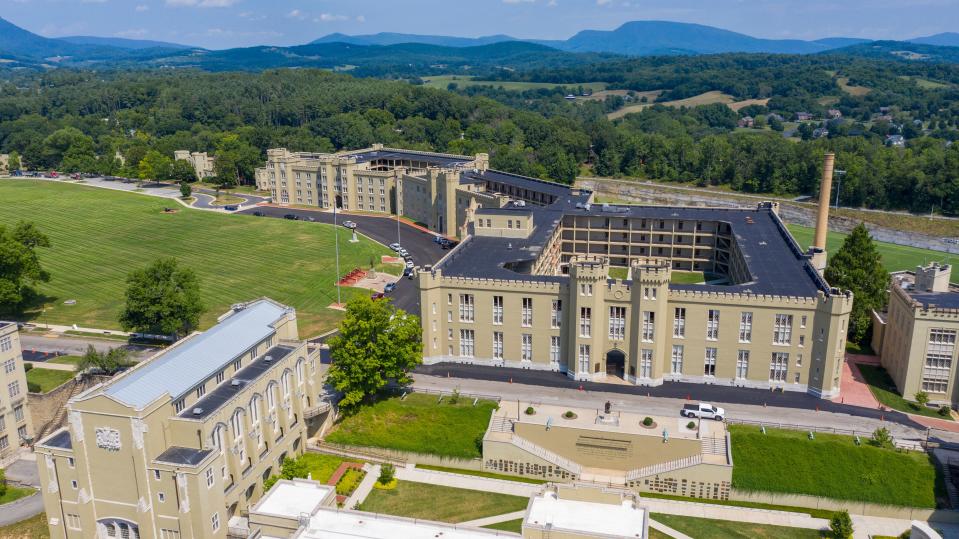 The barracks, right, and chapel, left, at Virginia Military Institute Wednesday July 15, 2020, in Lexington, Virginia. The school founded in 1839, is the oldest state-supported military college in the United States. ((AP Photo/Steve Helber))