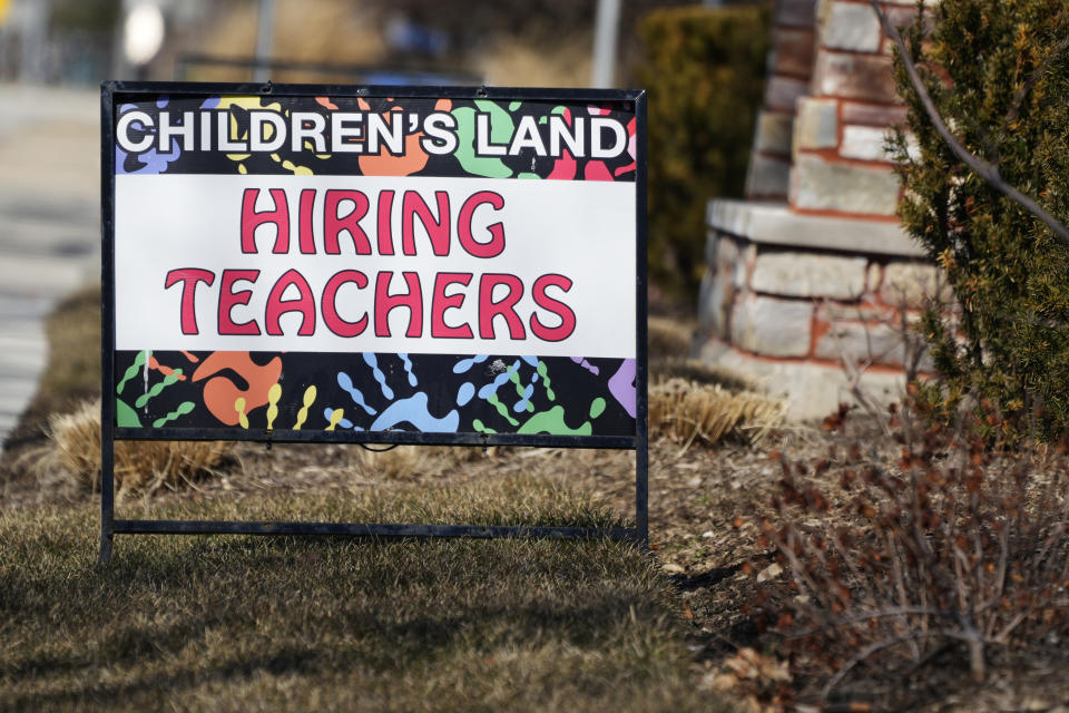 A hiring sign is displayed at a learning center in Mount Prospect, Ill., Sunday, March 19, 2023. On Friday, the U.S. government issues the March jobs report. (AP Photo/Nam Y. Huh)