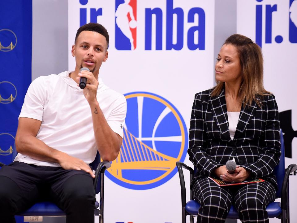 Stephen Curry #30 of the Golden State Warriors and Sonya Curry participate in a Jr NBA clinic and Parent Forum focused on positive coaching at the Ultimate Fieldhouse in Walnut Creek, California on October 11, 2017