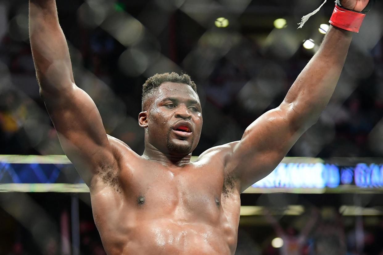 UFC 270 heavyweight world champion Cameroon's Francis Ngannou celebrates victory over France's Ciryl Gane after their fight for the heavyweight title at the Honda Center in Anaheim, California on January 22, 2022. (Photo by Frederic J. BROWN / AFP) (Photo by FREDERIC J. BROWN/AFP via Getty Images)