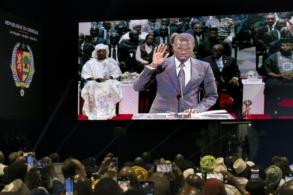 Bassirou Diomaye Faye is sworn in as Senegal's president in Dakar, Senegal, Tuesday, April 2, 2024. Senegal has sworn in Bassirou Diomaye Faye as its new president, completing the previously little-known opposition figure’s dramatic ascent from prison to the palace in recent weeks. Faye was released from prison less than two weeks before the March election following a political amnesty announced by the outgoing president. (AP Photo/Sylvain Cherkaoui)