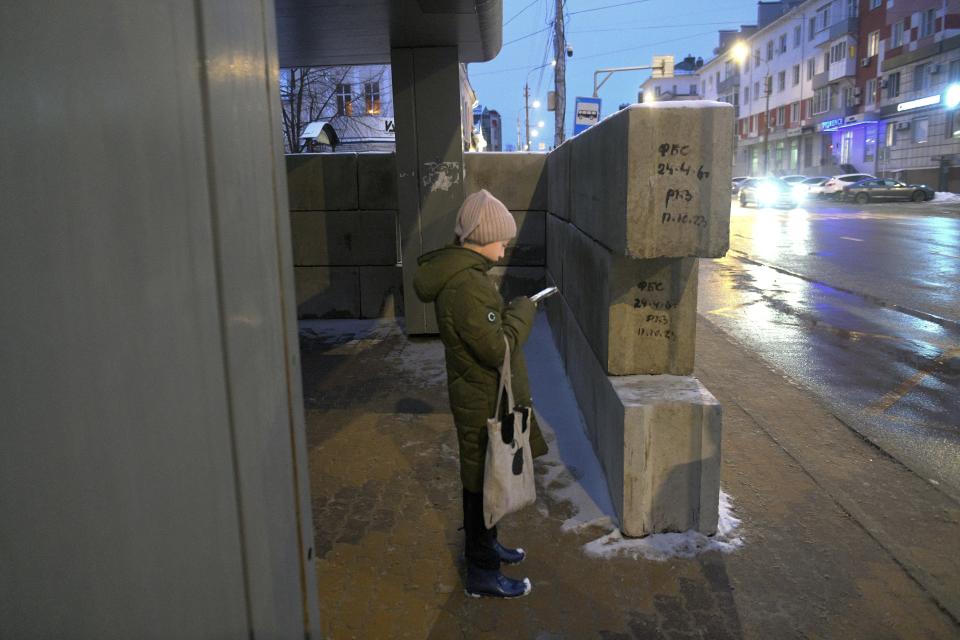 A girl stands at a bus stop in Belgorod, Russia, on Thursday, Jan. 25, 2024. Hundreds of bus stops in the city near the border with Ukraine have been reinforced with blocks of concrete and sandbags to protect them from rocket strikes following the Dec. 30 attack on the city that killed 25 and injured 109. Attacks like those on Belgorod are dealing a heavy blow to President Vladimir Putin’s attempts to reassure Russians that life in the country is largely untouched by the nearly 2-year-old conflict. (AP Photo)
