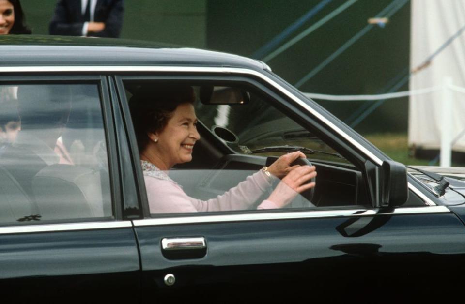 <p>Smiling broadly, the Queen drove away from the 1982 Windsor Horse Show. </p>