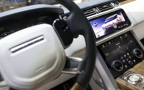 The screen displays an image inside a Range Rover SV Coupe sport utility vehicle (SUV) on display on day two of the 88th Geneva International Motor Show in Geneva, Switzerland, on Wednesday, March 7, 2018. The show opens to the public on March 8, and will showcase the latest models from the world's top automakers. Photographer: Chris Ratcliffe/Bloomberg  - Credit: Chris Ratcliffe /Bloomberg