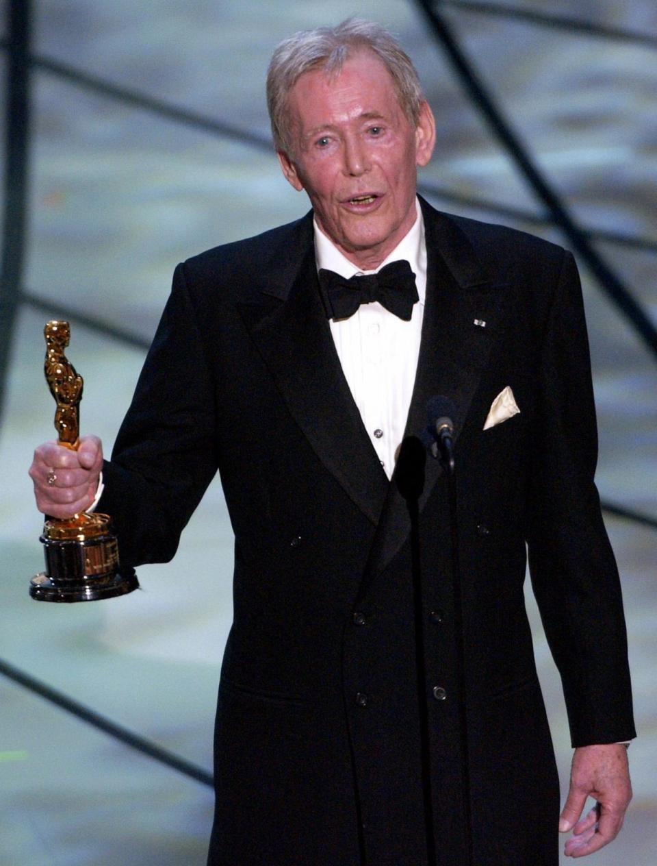 PHOTO: In this March 23, 2003, file photo, actor Peter O'Toole accepts his honorary Oscar from the Academy of Motion Picture Arts and Sciences during the 75th annual Academy Awards telecast in Los Angeles.  (Kevork Djansezian/AP, FILE)