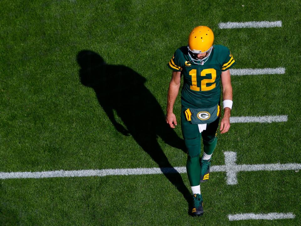 Aaron Rodgers warms up ahead of a game against the Washington Football Team.