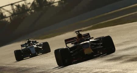 Formula One - F1 - Test session - Barcelona-Catalunya racetrack in Montmelo, Spain - 10/3/17. Red Bull's Max Verstappen is followed by Mercedes' Lewis Hamilton. REUTERS/Albert Gea