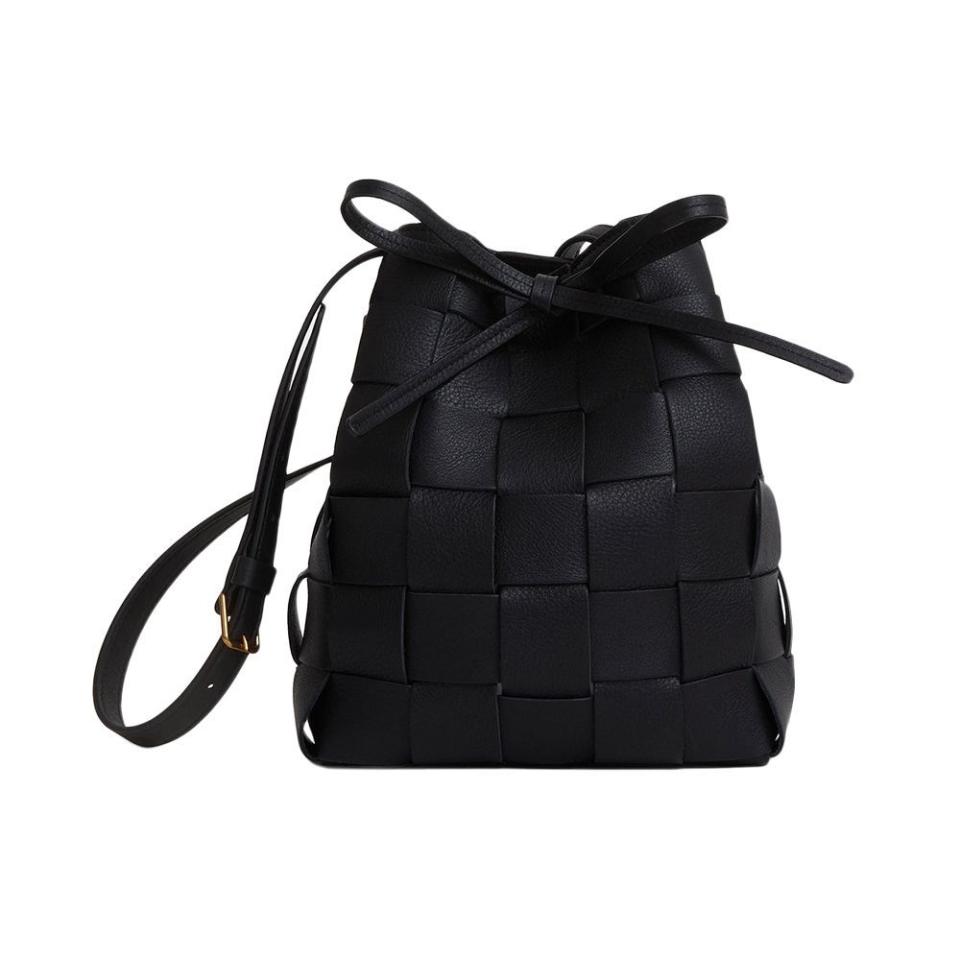 <p><a href="https://go.redirectingat.com?id=74968X1596630&url=https%3A%2F%2Fwww.mansurgavriel.com%2Fproducts%2Fmini-woven-bucket-black&sref=https%3A%2F%2F" rel="nofollow noopener" target="_blank" data-ylk="slk:Shop Now;elm:context_link;itc:0;sec:content-canvas" class="link ">Shop Now</a></p><p>Upcycled Woven Mini Bucket Bag</p><p>mansurgavriel.com</p><p>$545.00</p>