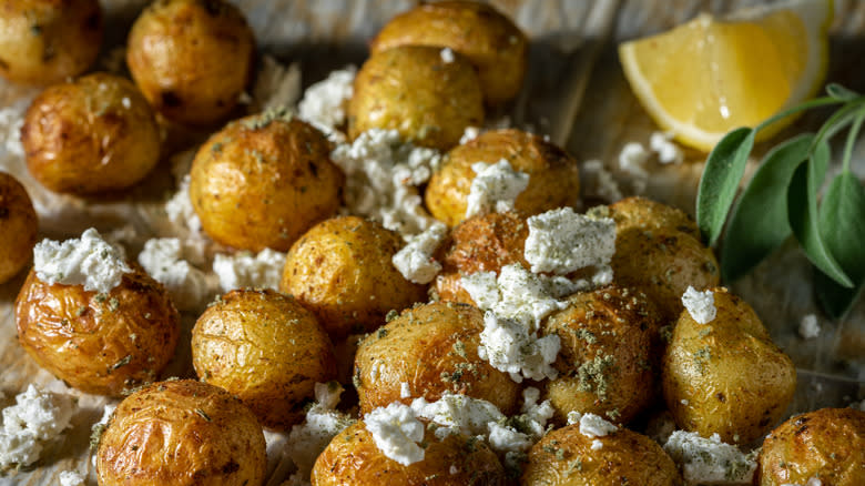 Roasted baby potatoes with feta cheese, herbs, and lemon