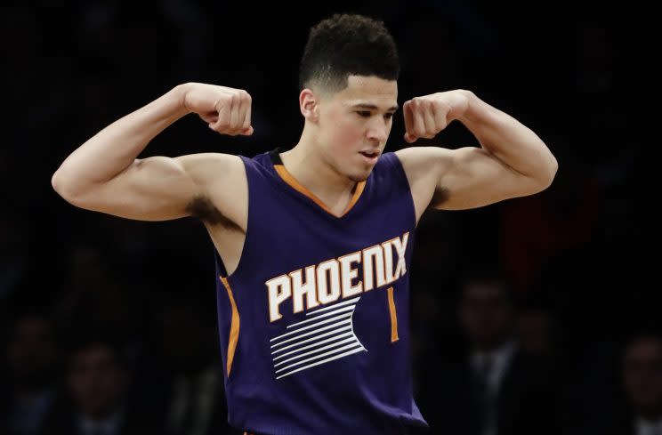 Phoenix Suns shooting guard Devin Booker, age 20, shows everybody what a big strong boy he is. (AP)