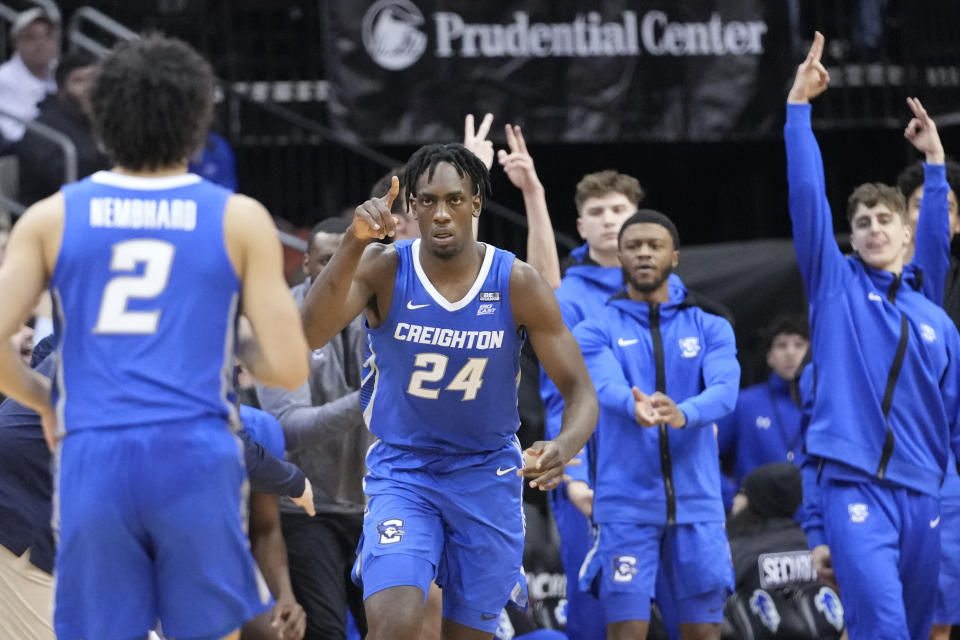 Creighton forward Arthur Kaluma (24) reacts after scoring a three-point basket during the second half of an NCAA college basketball game against Seton Hall, Wednesday, Feb. 8, 2023, in Newark, N.J. Creighton won 75-62. (AP Photo/Mary Altaffer)