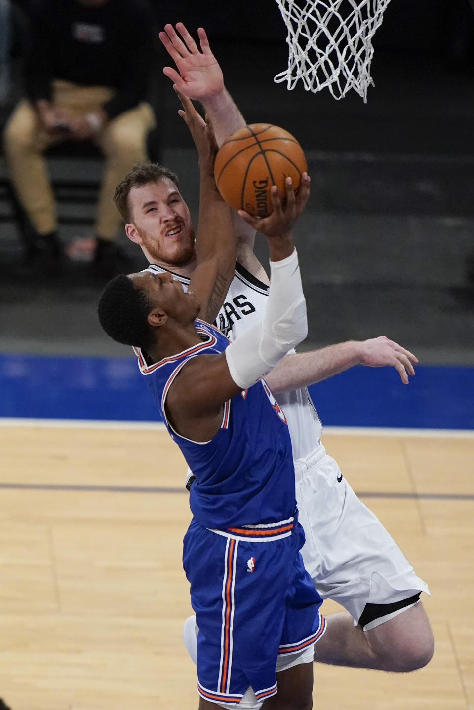 New York Knicks' RJ Barrett, left, drives past San Antonio Spurs' Jakob Poeltl during the second half of an NBA basketball game Thursday, May 13, 2021, in New York. (AP Photo/Frank Franklin II, Pool)