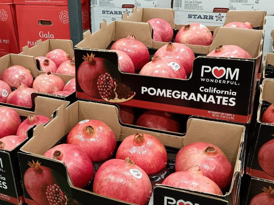 black and red boxes full of pomegranates at Costco