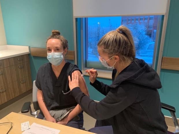 Dr. AnneMarie Pegg, territorial medical director, receives her first dose of the Moderna COVID-19 vaccine at Stanton Territorial Hospital on Jan. 10.