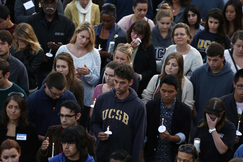 UC Santa Barbara students attend a candlelight vigil following Friday's series of drive-by shootings in Isla Vista