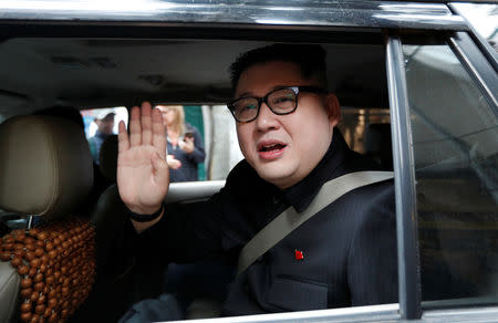 Howard X, an Australian impersonating North Korean leader Kim Jong Un, leaves the La Paix Hotel in a car while escorted by police, in Hanoi, Vietnam February 25, 2019. REUTERS/Jorge Silva