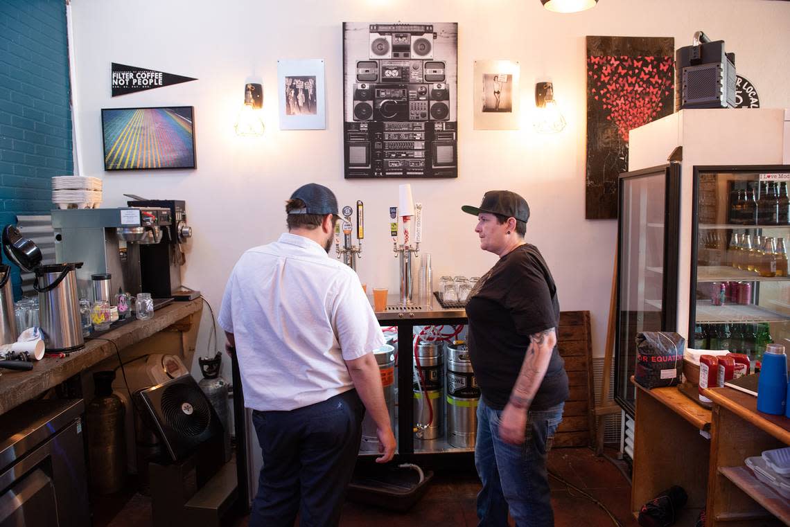 Deva Cafe owner Heather Elkins, right, has beer distributer pick up surplus beer in Modesto, Calif., Tuesday, Oct. 25, 2022.