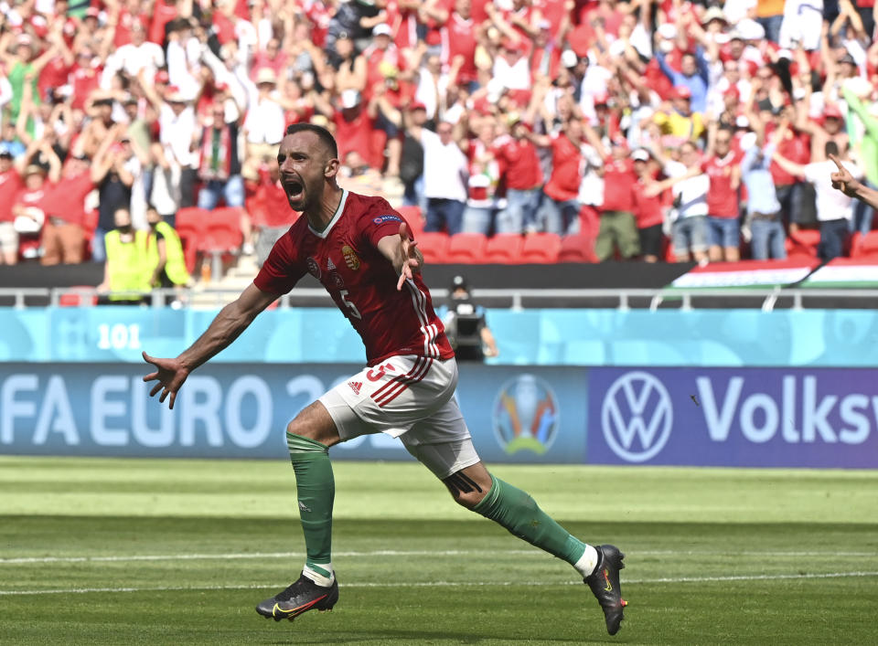 Hungary's Attila Fiola celebrates after scoring his sides first goal during the Euro 2020 soccer championship group F match between Hungary and France at the Ferenc Puskas stadium in Budapest, Hungary Saturday, June 19, 2021. (Tibor Illyes/Pool via AP)
