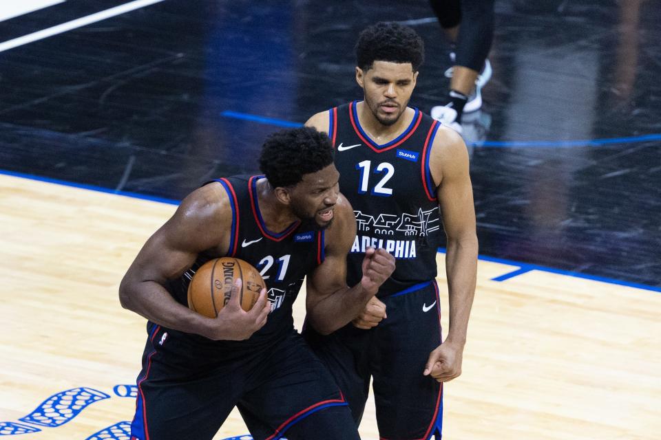 Joel Embiid (21) and Tobias Harris have led the 76ers to the No. 1 seed in the Eastern Conference.