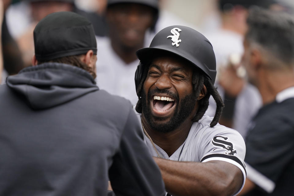 Chicago White Sox's Brian Goodwin greets Billy Hamilton after hitting a three-run home run during the second inning of a baseball game against the Detroit Tigers, Saturday, June 12, 2021, in Detroit. (AP Photo/Carlos Osorio)