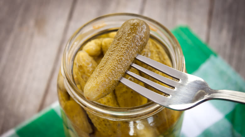 taking a pickle from jar